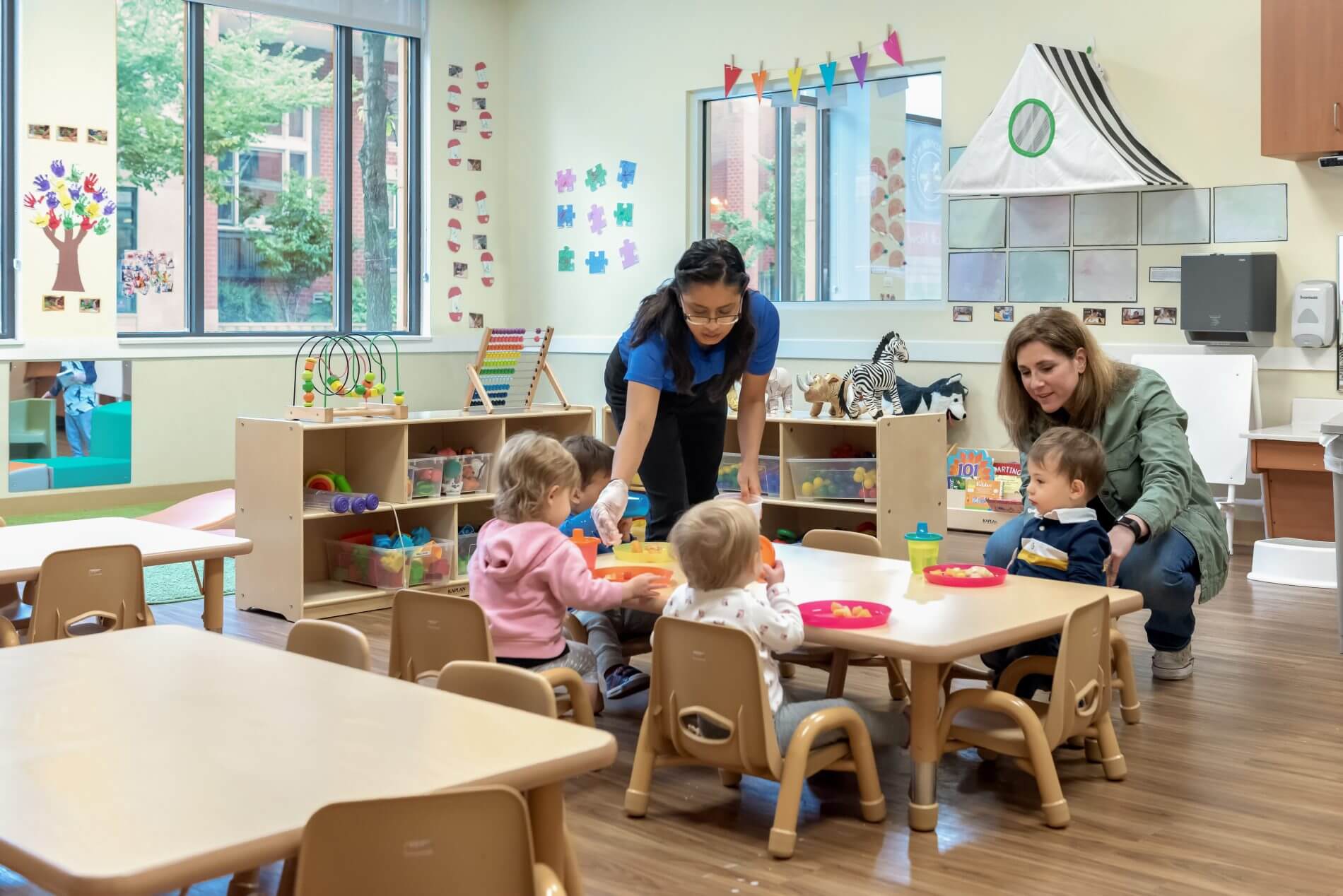 mother dropping off child at preschool