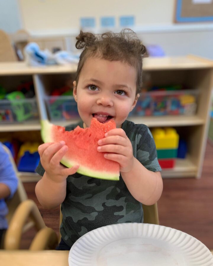 toddler eating watermelon