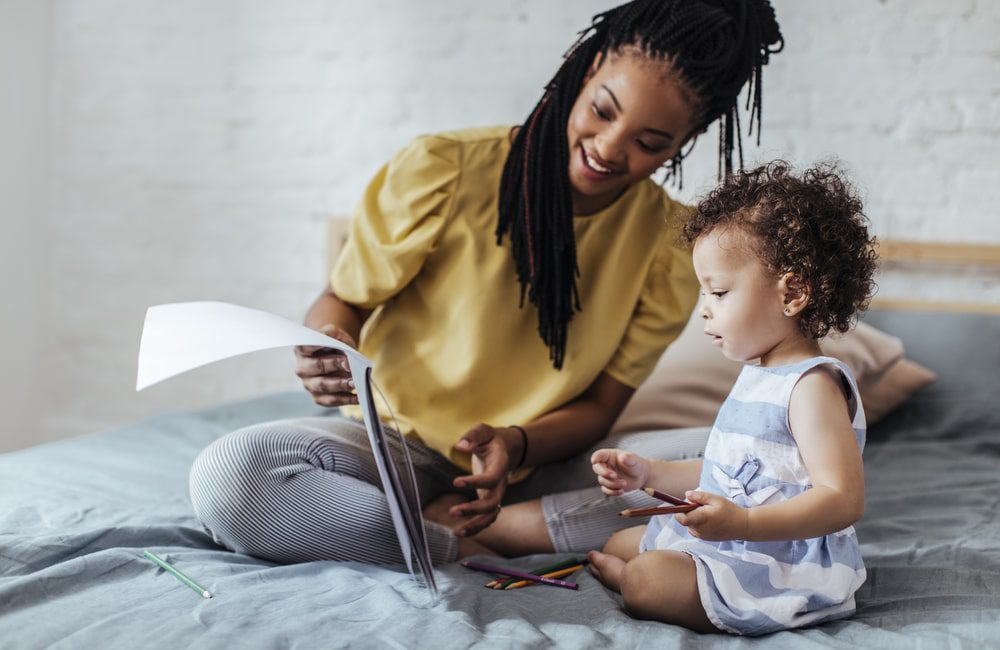 mom and young child reading book