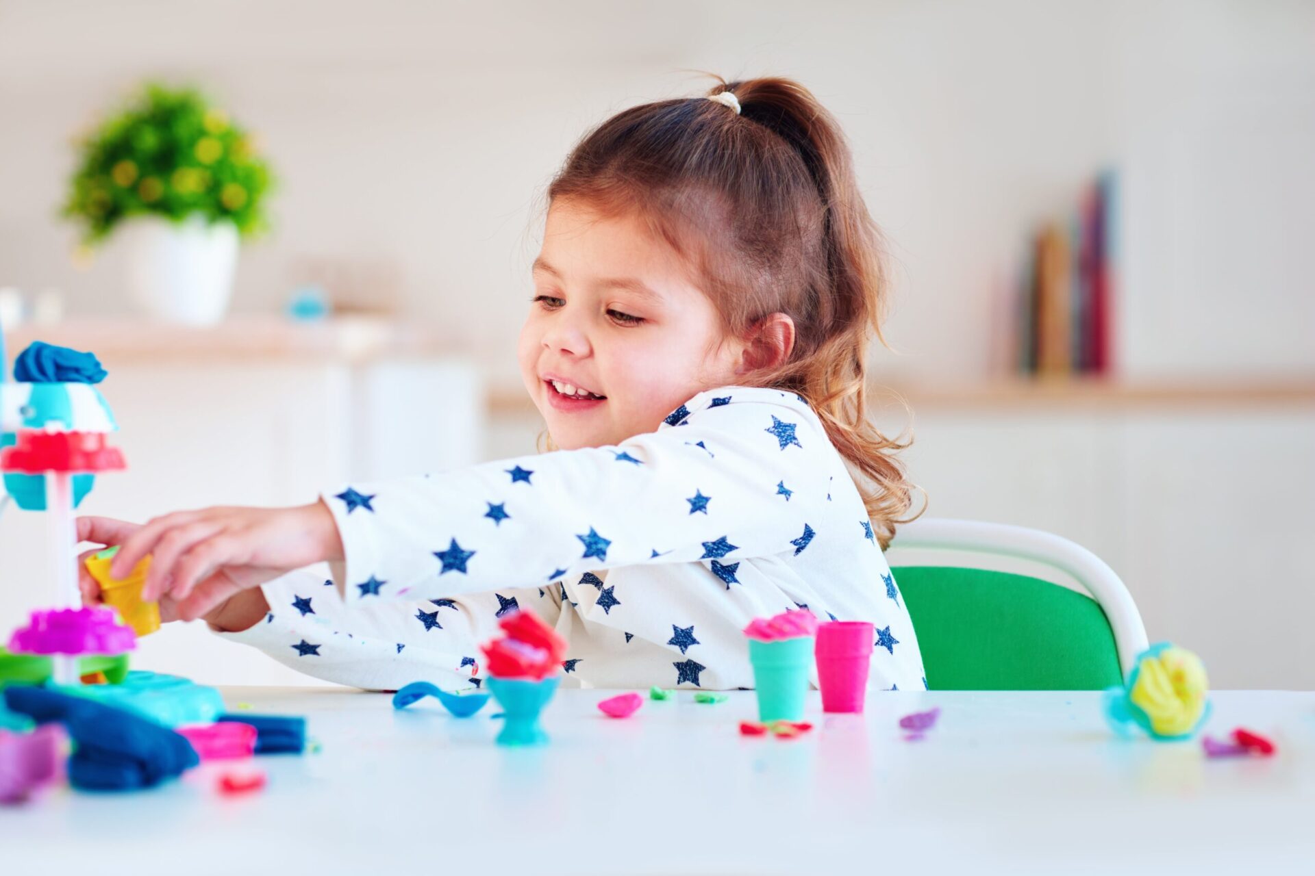 preschool girl playing with play-doh