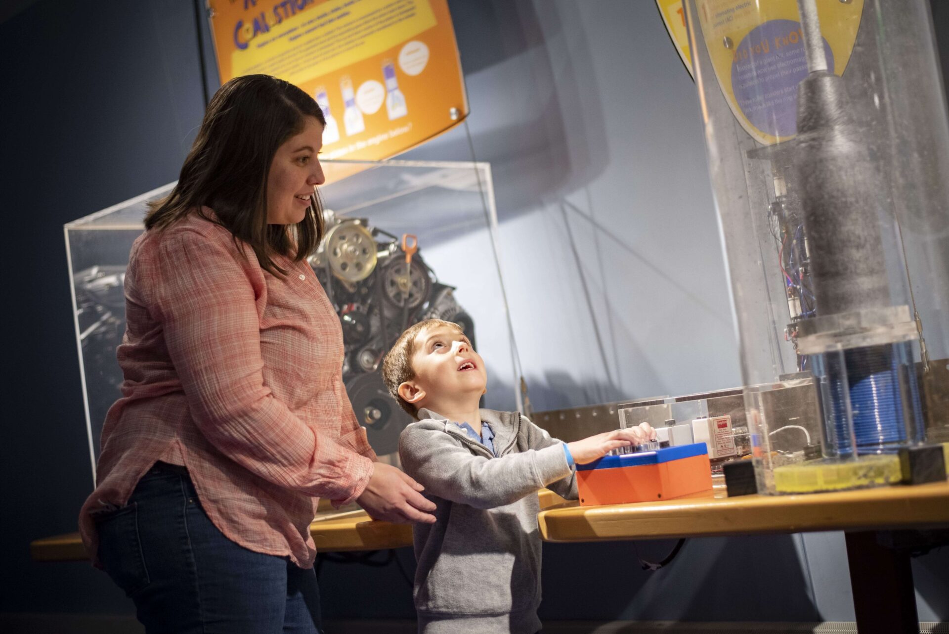 mother and son playing with a display at Center of Science and Industry COSI