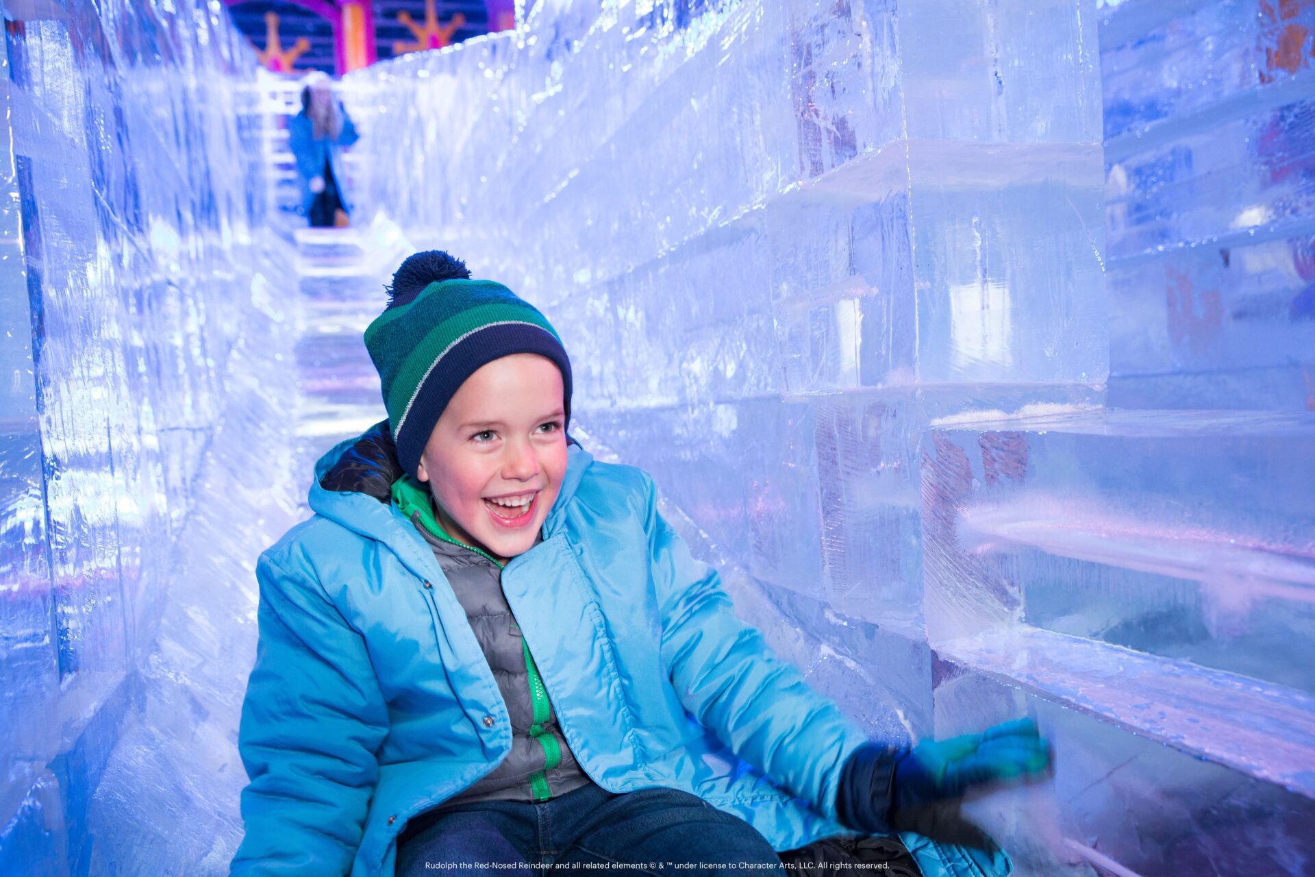 child on a slide made of ice