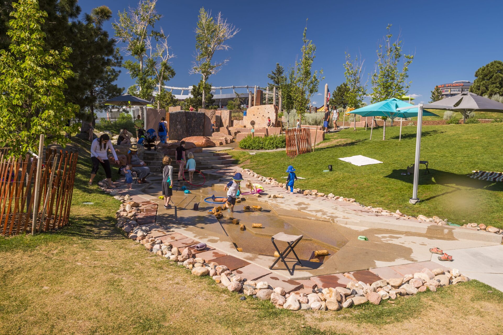 children playing outside at Joy Park at the Children’s Museum of Denver 