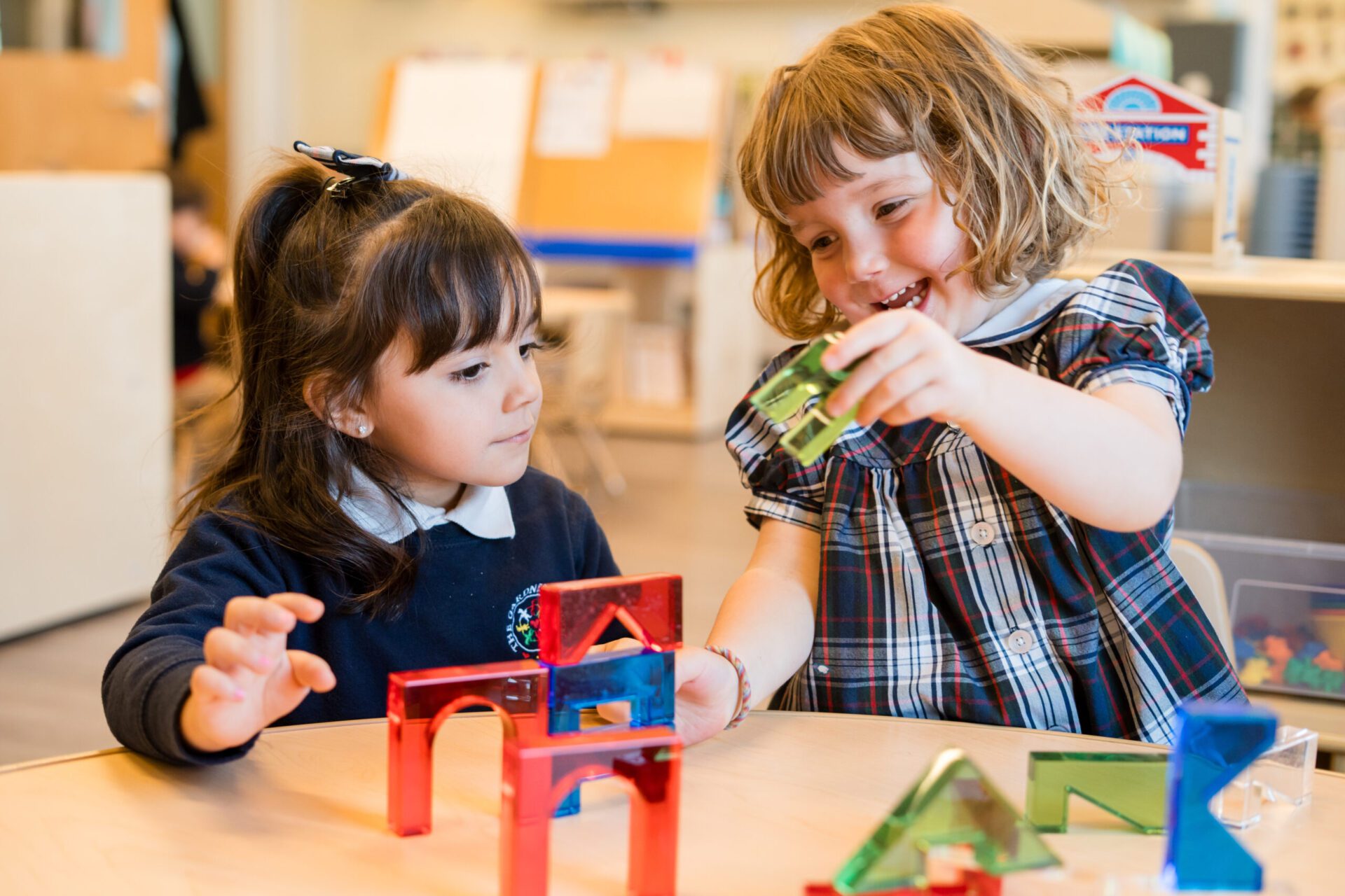 Preschoolers building blocks together.