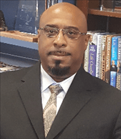 Headshot of Dr. Carlos Beane