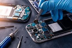 student working on an electronic machine