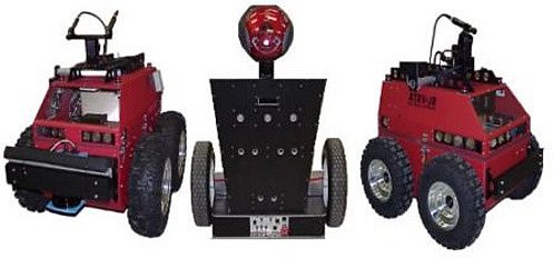 red robotic machines with wheels