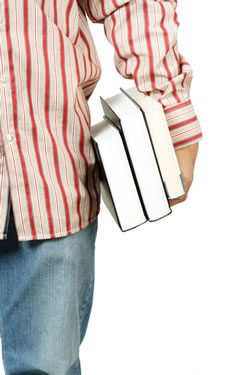 student wearing a red striped shirt holding books