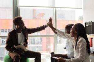 students high fiving each other