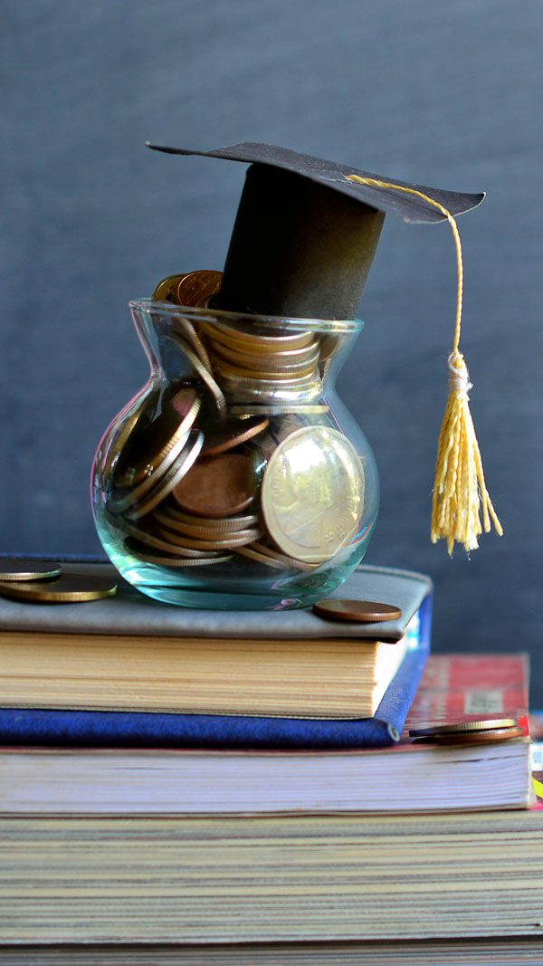 a small graduation gap inside a glass jar with coins