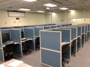 cubicles with computers in a room