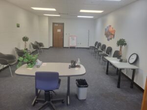 testing center waiting room with chairs and tables