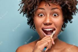 a woman brushing her teeth