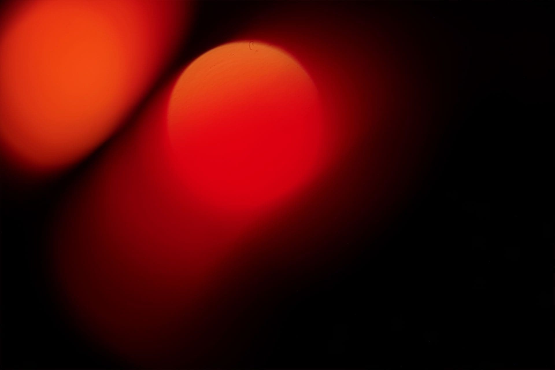 bg abstract red and orange circles on black background
